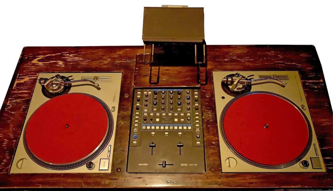 A vintage DJ setup with turntables and speakers