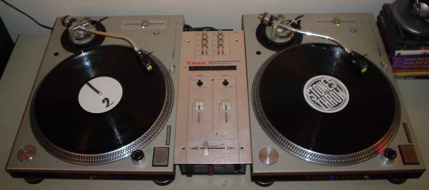 DJ turntables and a mixer set up for a club night