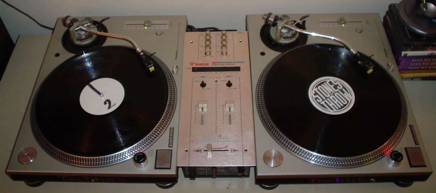 DJ turntables and a mixer set up for a club night
